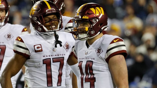 Washington Commanders quarterback Sam Howell (14) and receiver Terry McLaurin (17) celebrate a play in Week 18.